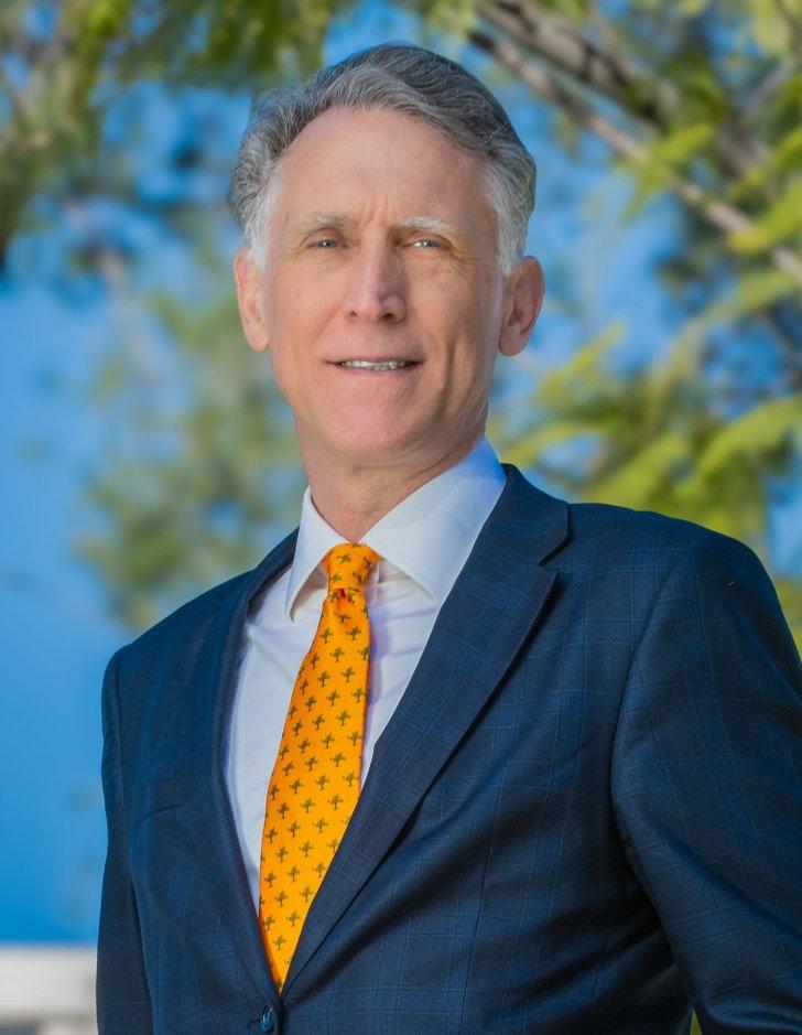 A photo of Pitzer College's seventh President, Strom C. Thacker with McConnell Center in the background.